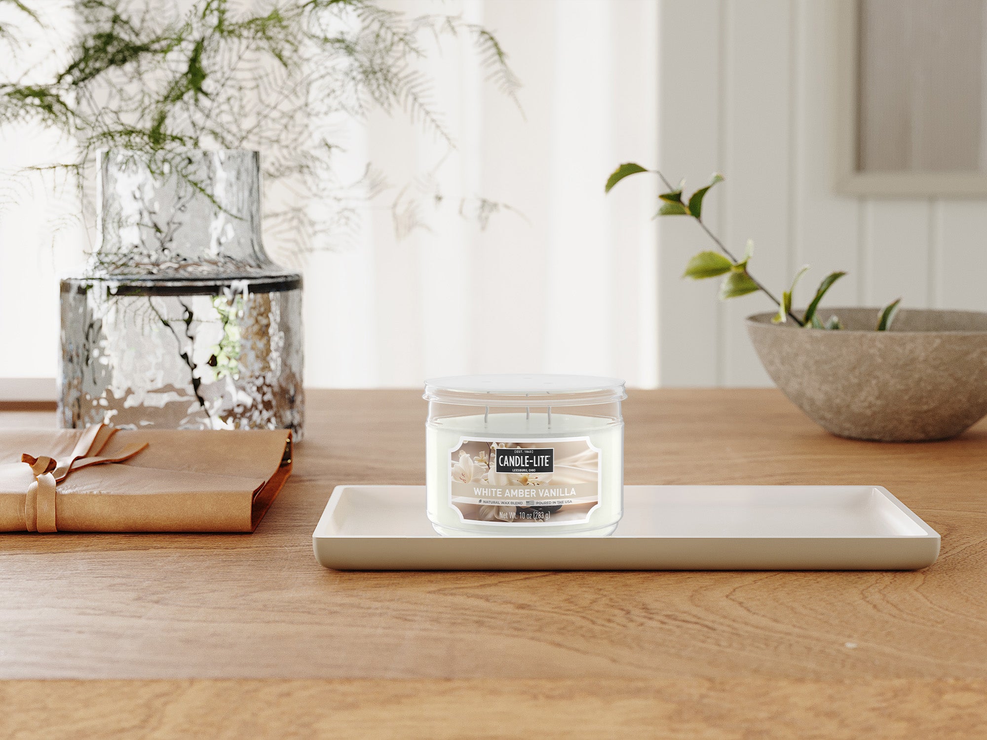 Candle on a wooden table with decorative items