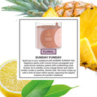 Scented candle labeled 'Sunday Funday' with pineapple and lemon elements on a white background