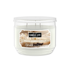 Candle-Lite White Amber Vanilla candle in a clear container on a white background